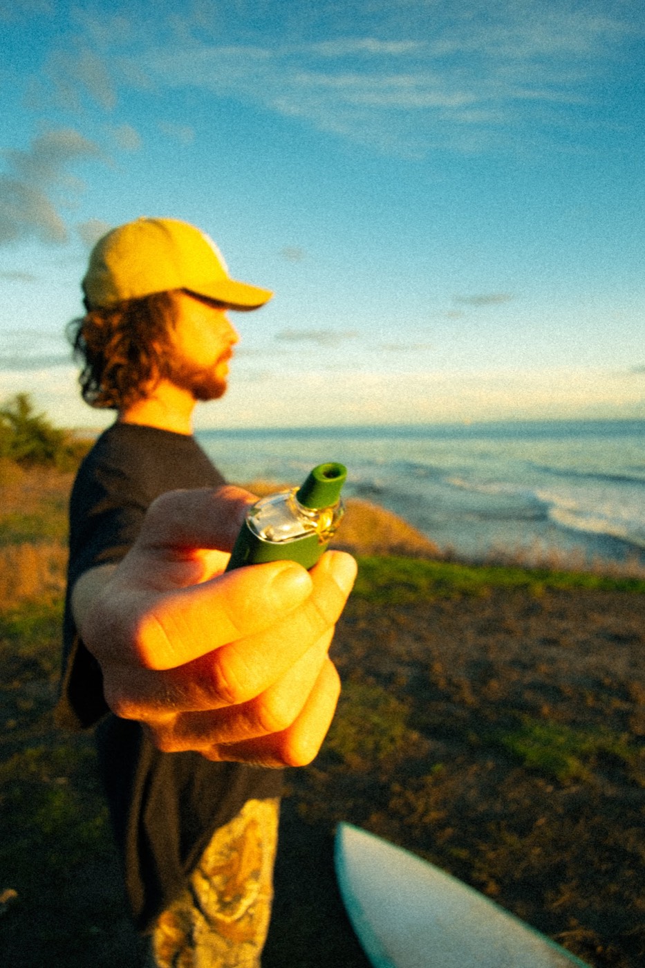 Raw Garden lifestyle, golden hour at the coast with a surfboard